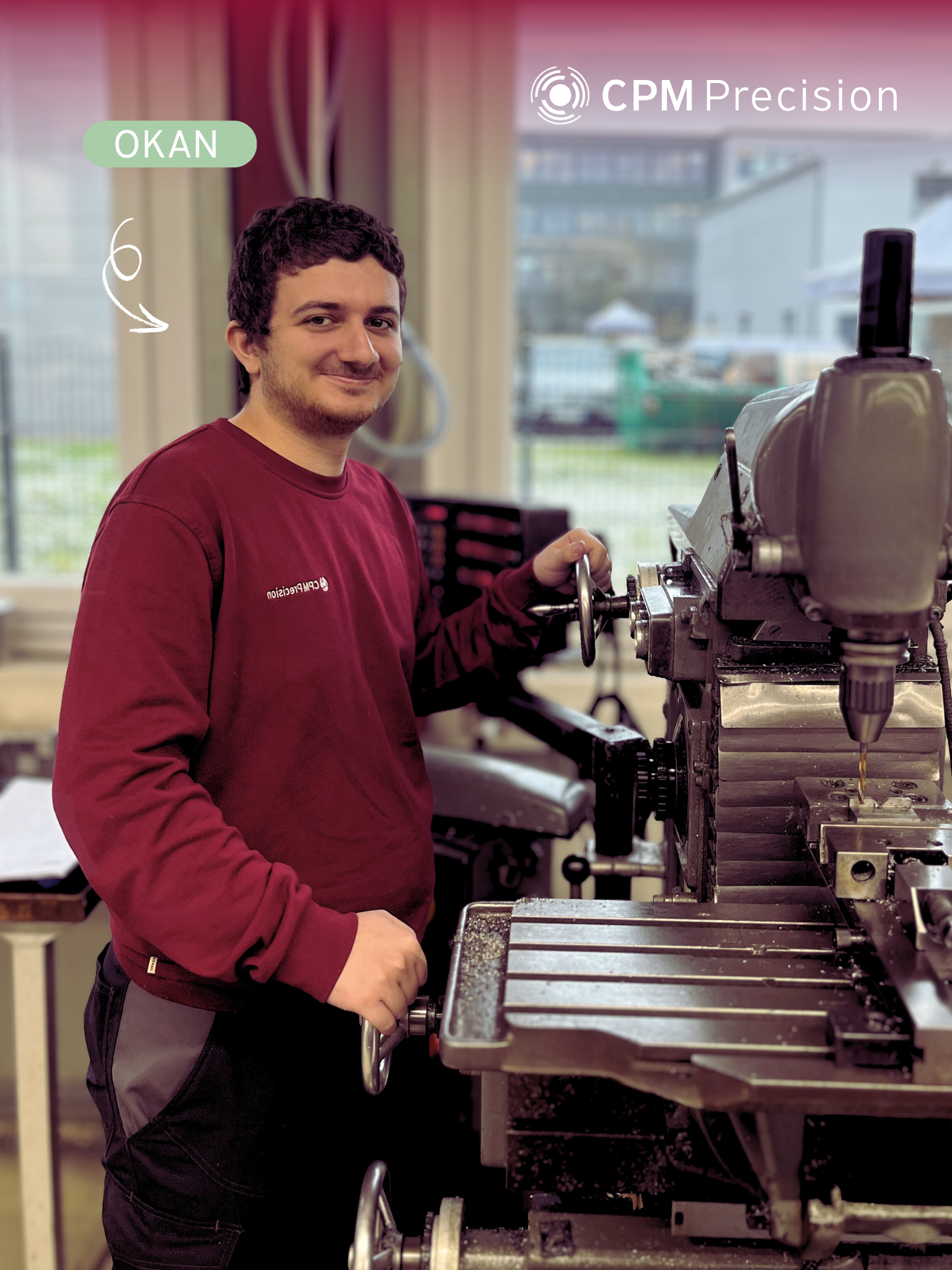 Okan, one of the new apprentices at CPM Precision, is standing at a conventional milling machine in our production hall and looking friendly into the camera.